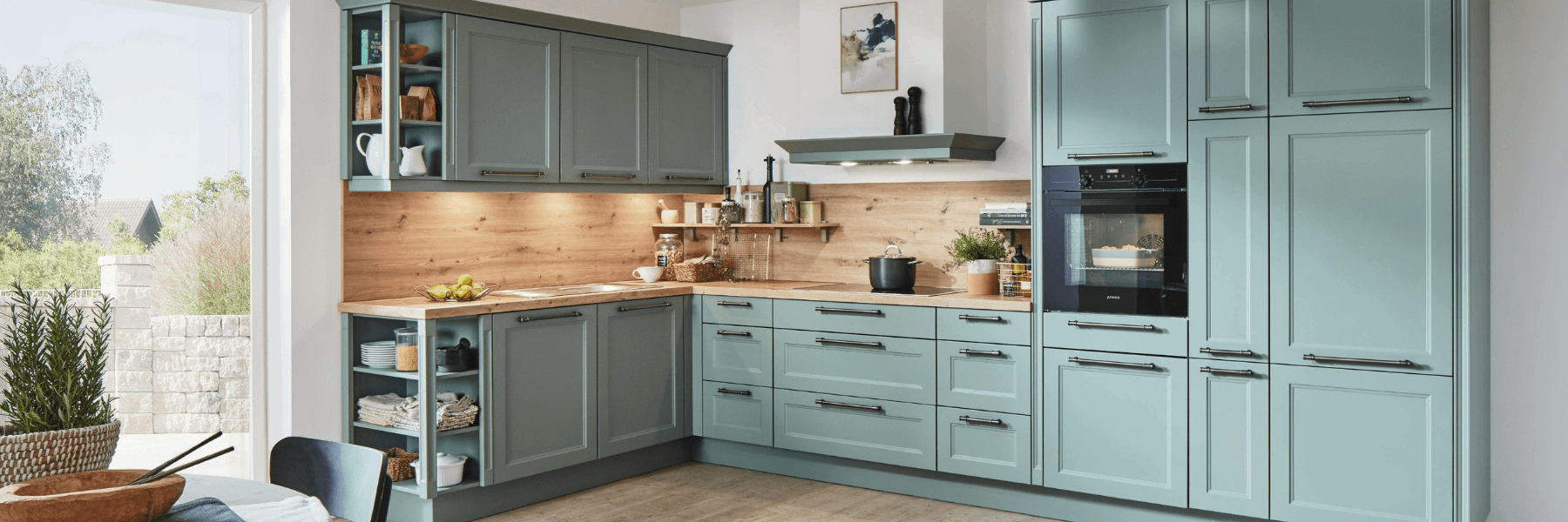 Modern blue flatpack kitchen showcasing stylish cabinetry and wood accents for kitchen renovations and design inspiration.